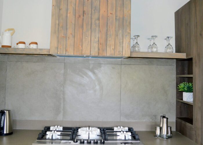 Kitchen view of 5 burner cooker and hob. Wine rack also available